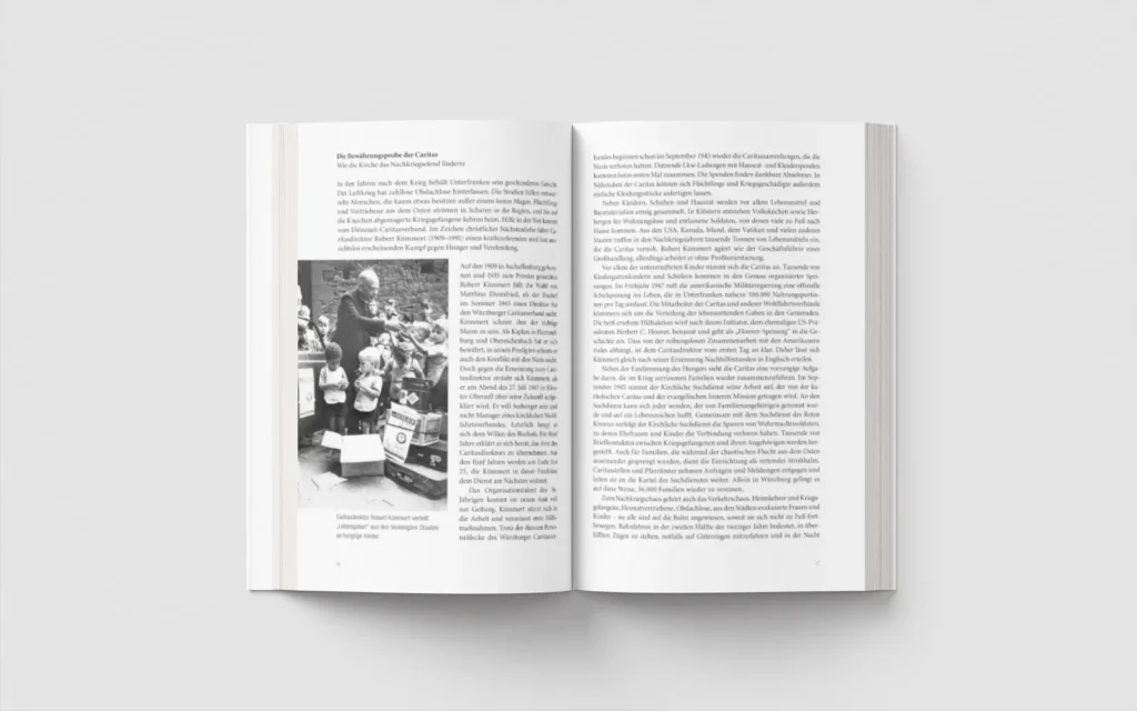 Aufgeschlagenes Buch mit dem Titel "Aufbrüche und Kontroversen" von Prof. Dr. Merz und Prof. Dr. Weiß, erschienen im echter Verlag